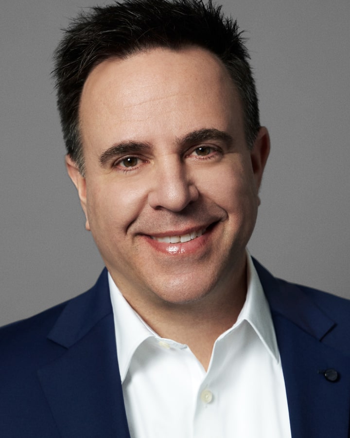 Professional headshot of Paul Tchinnis smiling